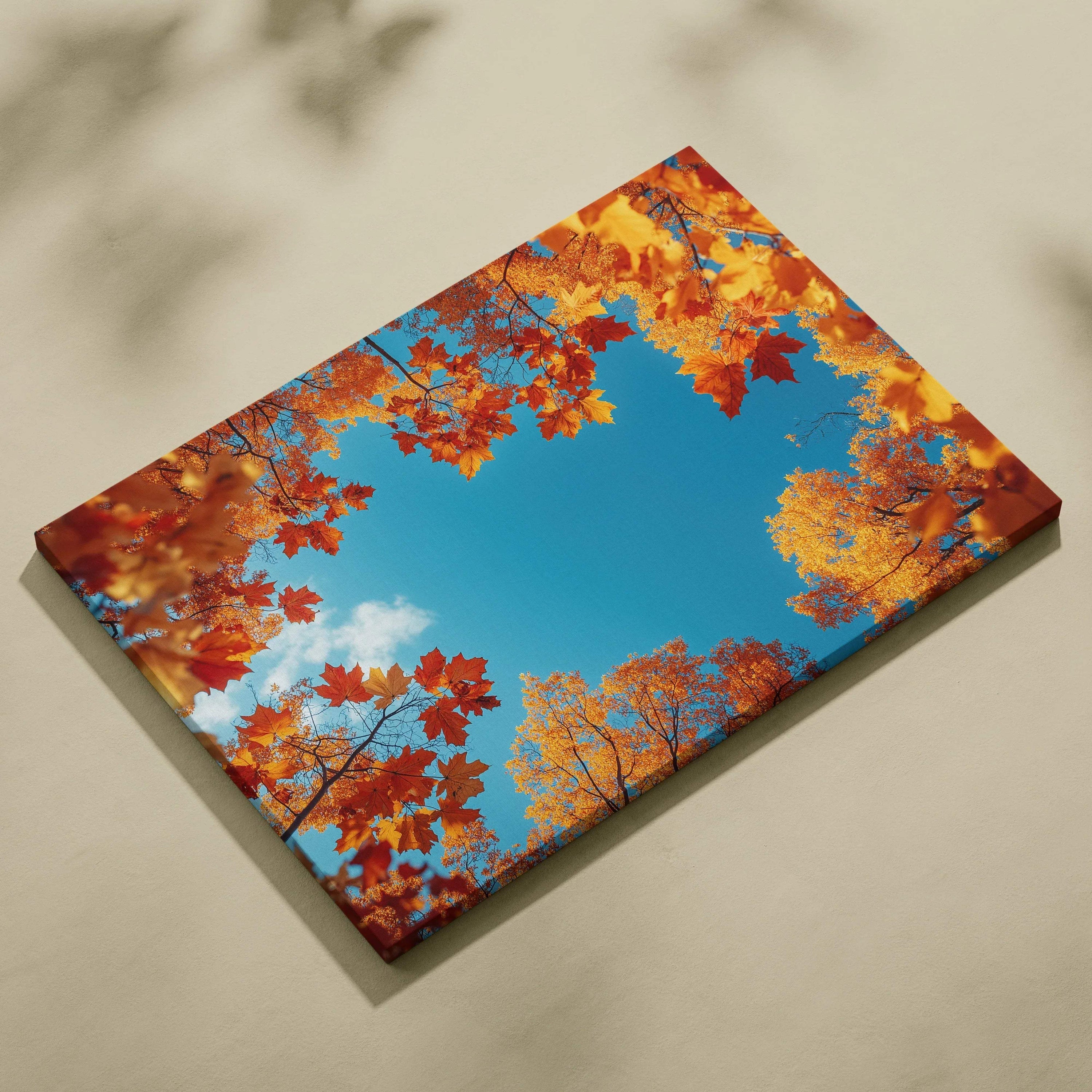 Canvas art of vibrant autumn leaves in red and gold framing a bright blue sky, wall art decor.