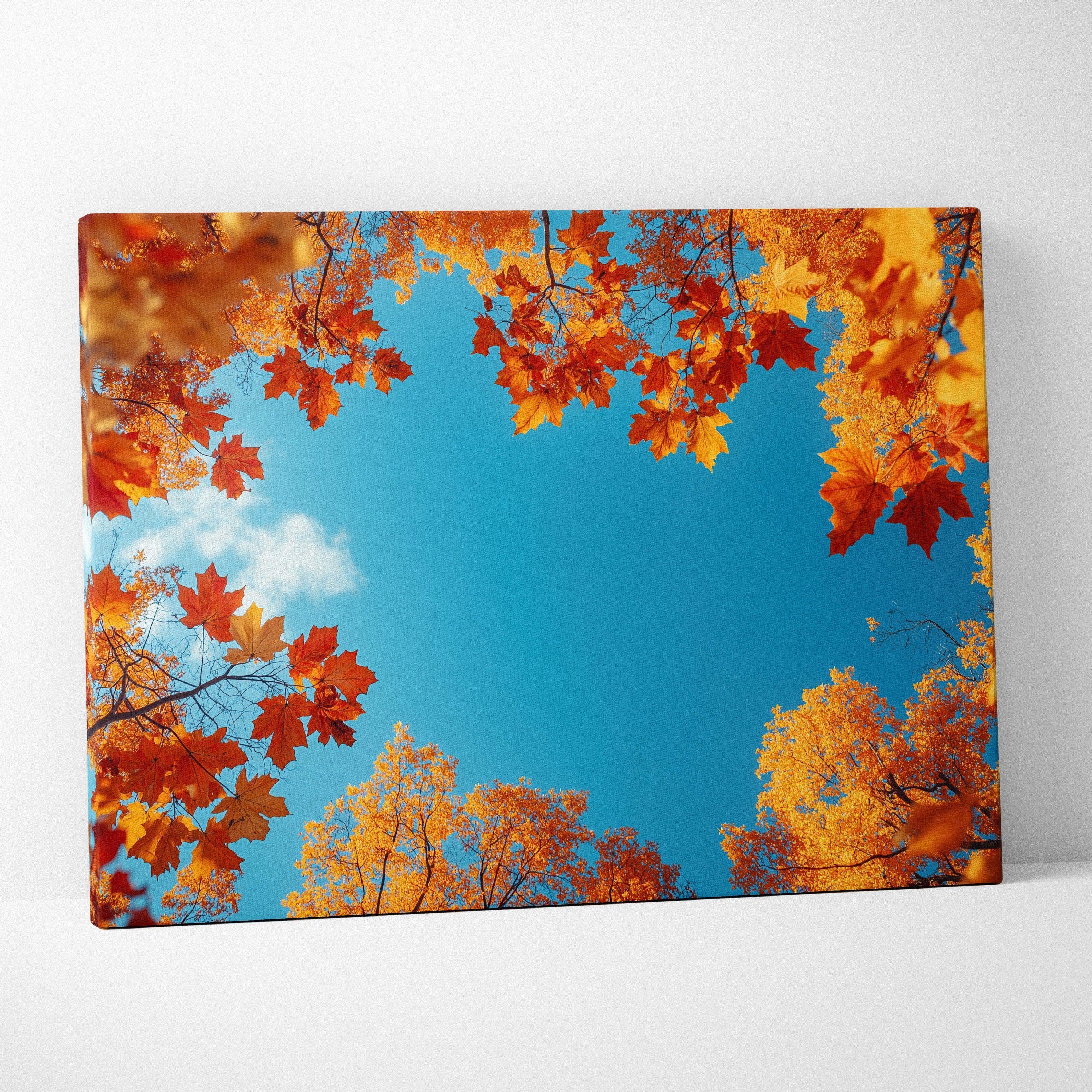 Canvas art of vibrant golden autumn leaves framing bright blue sky, modern wall art print.