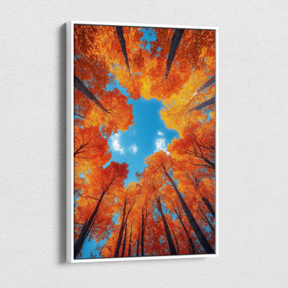 Autumn forest canopy with vibrant orange leaves against blue sky on vertical canvas wall art.