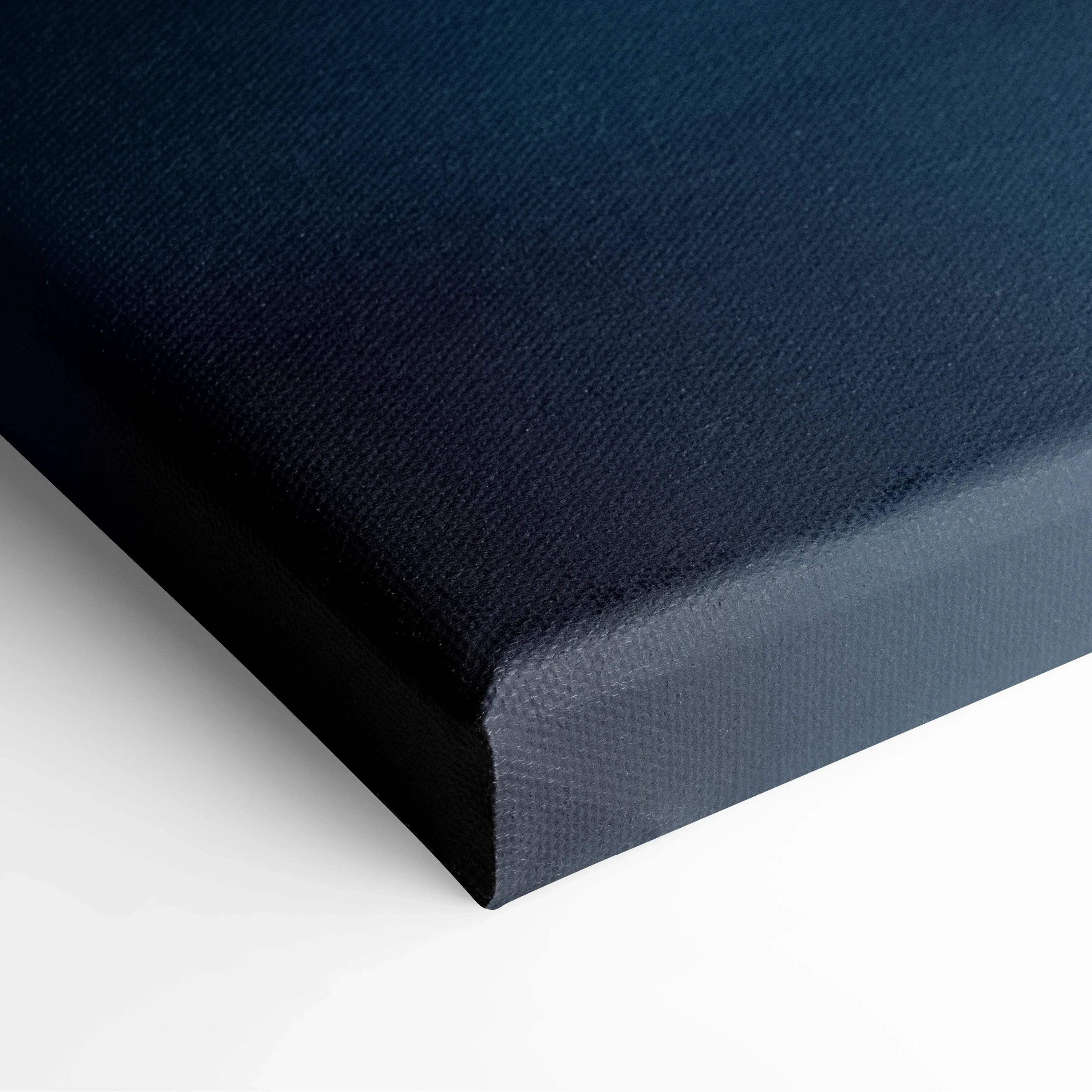 Black stretched canvas art with textured surface and clean edges for wall art display.