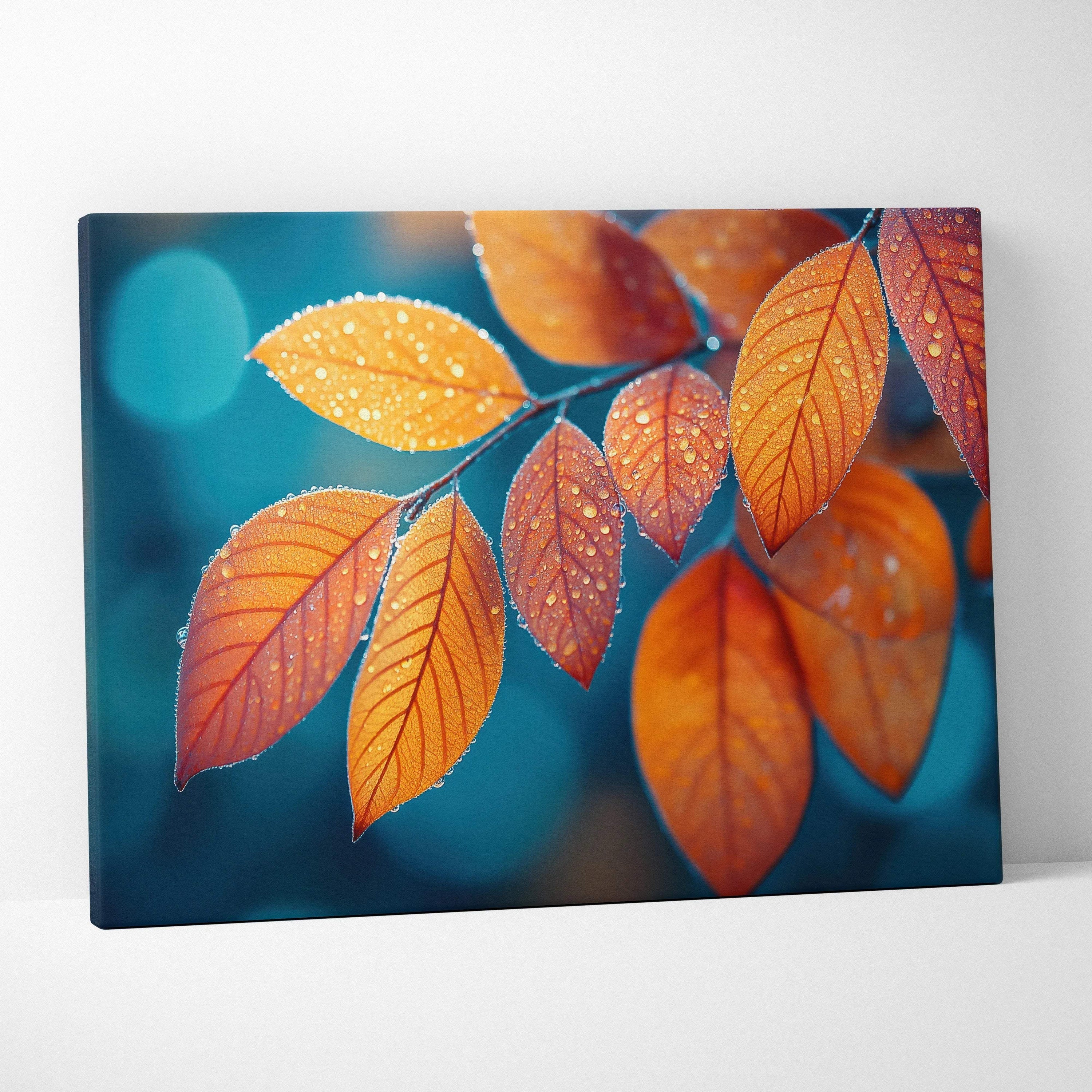 Canvas art featuring vibrant orange autumn leaves with dew drops against a soft blue background, perfect nature wall art.