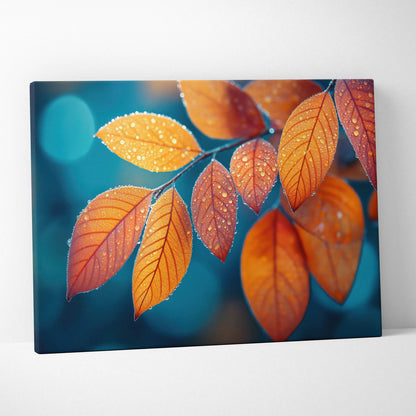 Canvas art featuring vibrant orange autumn leaves with dew drops against a soft blue background, perfect nature wall art.