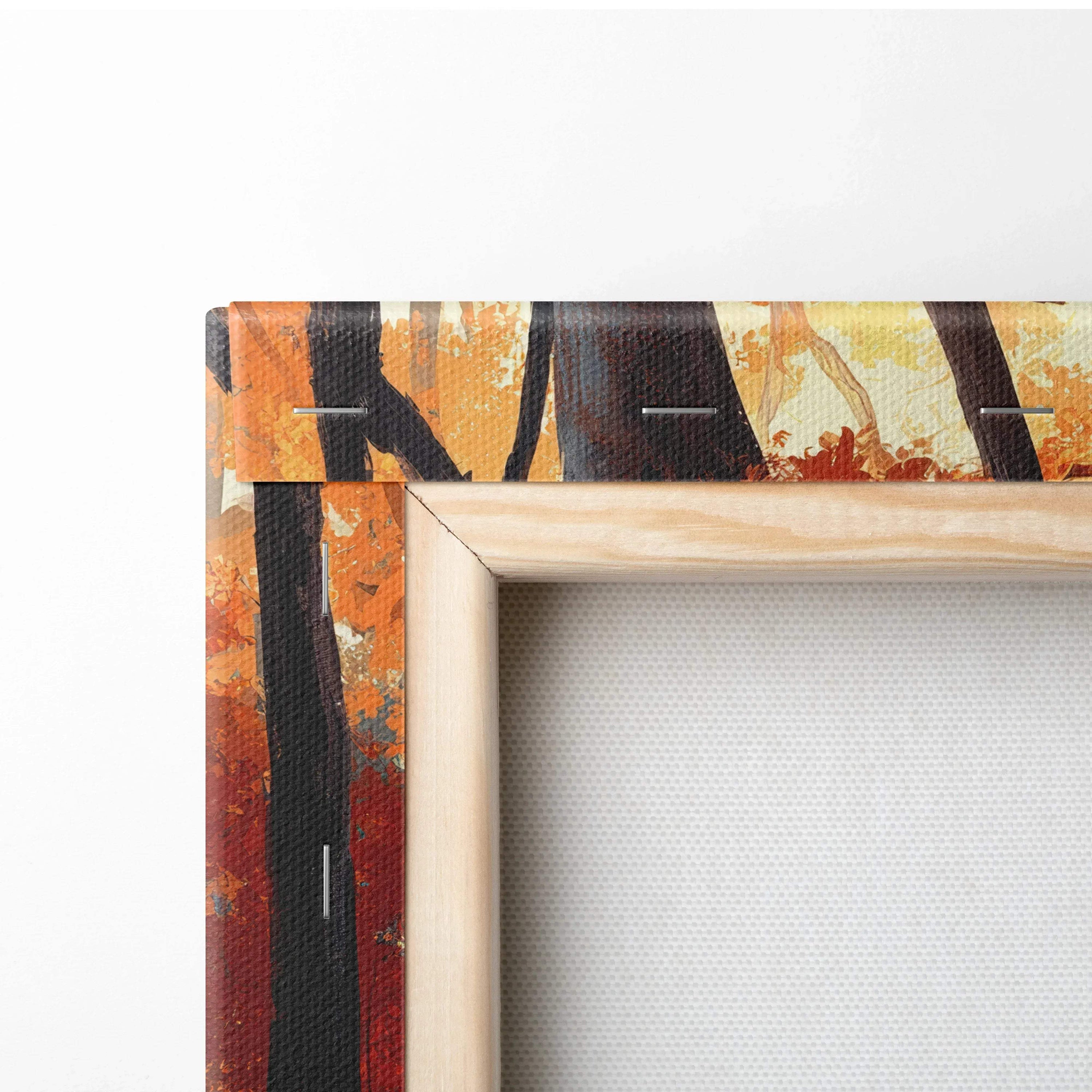 Autumn forest canvas art stretched over wooden frame corner with vibrant orange and yellow tones.