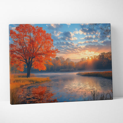 Canvas art of vibrant autumn tree with orange leaves by a reflective lake under a colorful sunset sky wall art.