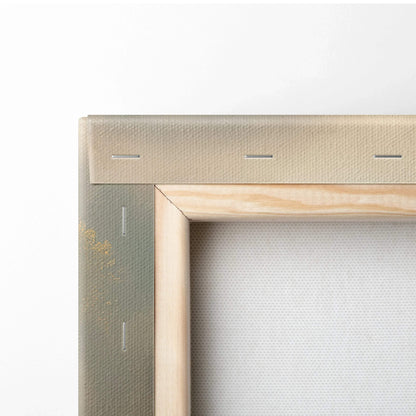 Close-up of wooden stretcher bars and stapled edge on a wrapped canvas art panel.