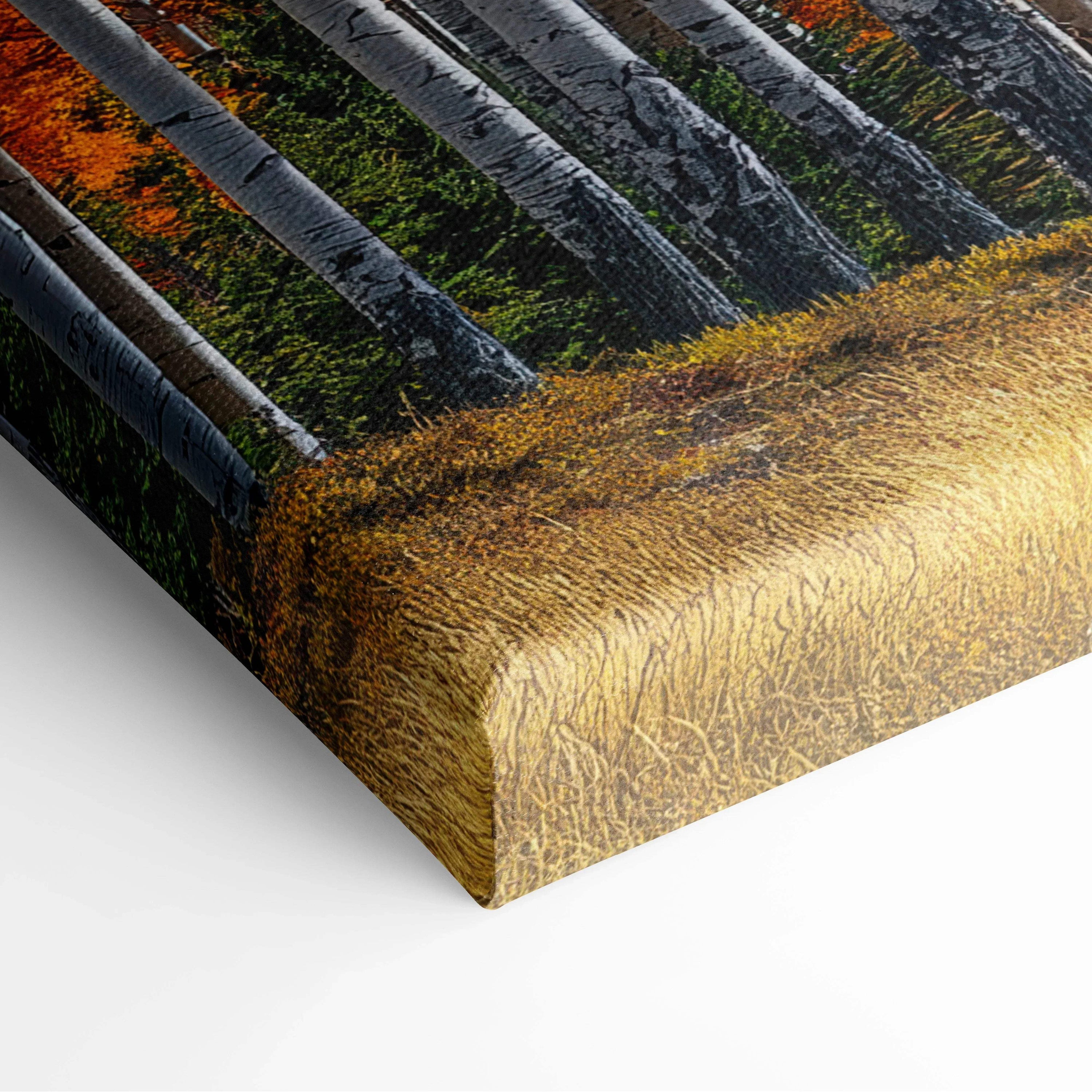 Close-up of canvas art showing textured golden autumn grass and tree trunks in vibrant fall colors for wall art.