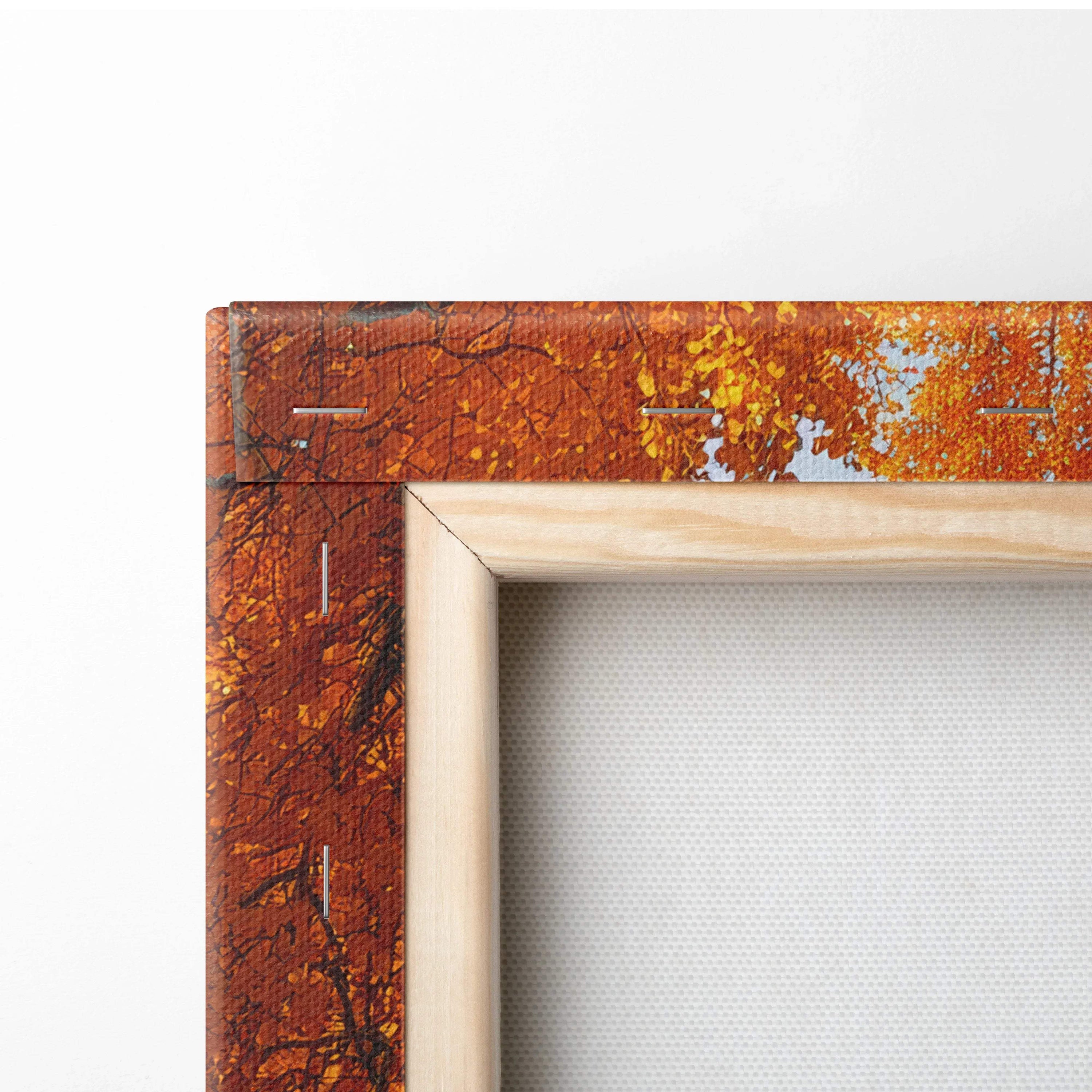 Close-up of vibrant autumn leaves canvas art with wooden frame, textured wall art detail.