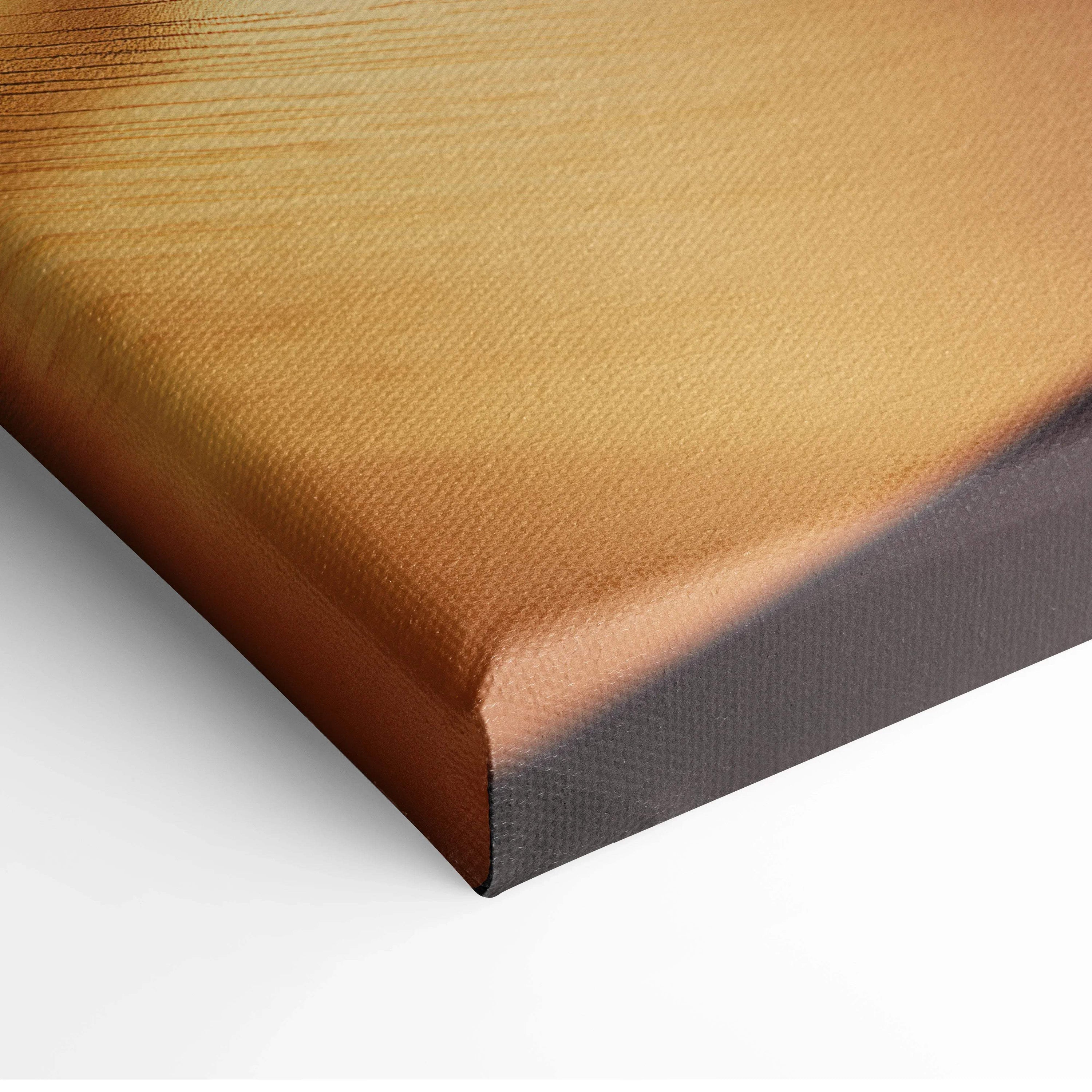 Close-up of textured beige canvas wall art with wrapped edges for home decor.
