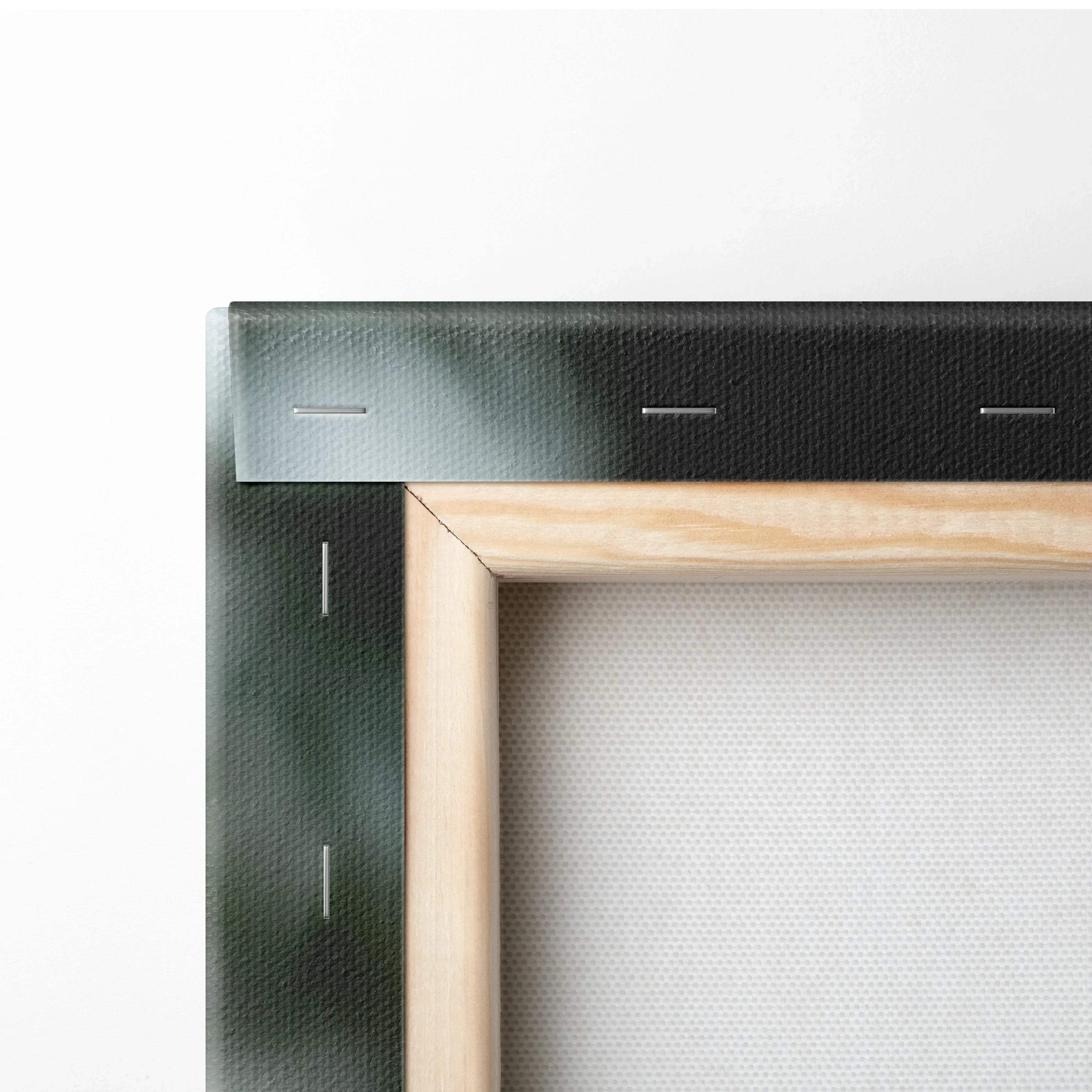 Close-up of wooden frame and stapled white canvas fabric for wall art decor.