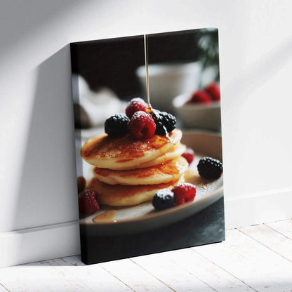 Vertical canvas wall art featuring golden pancakes topped with syrup and fresh mixed berries for kitchen decor.