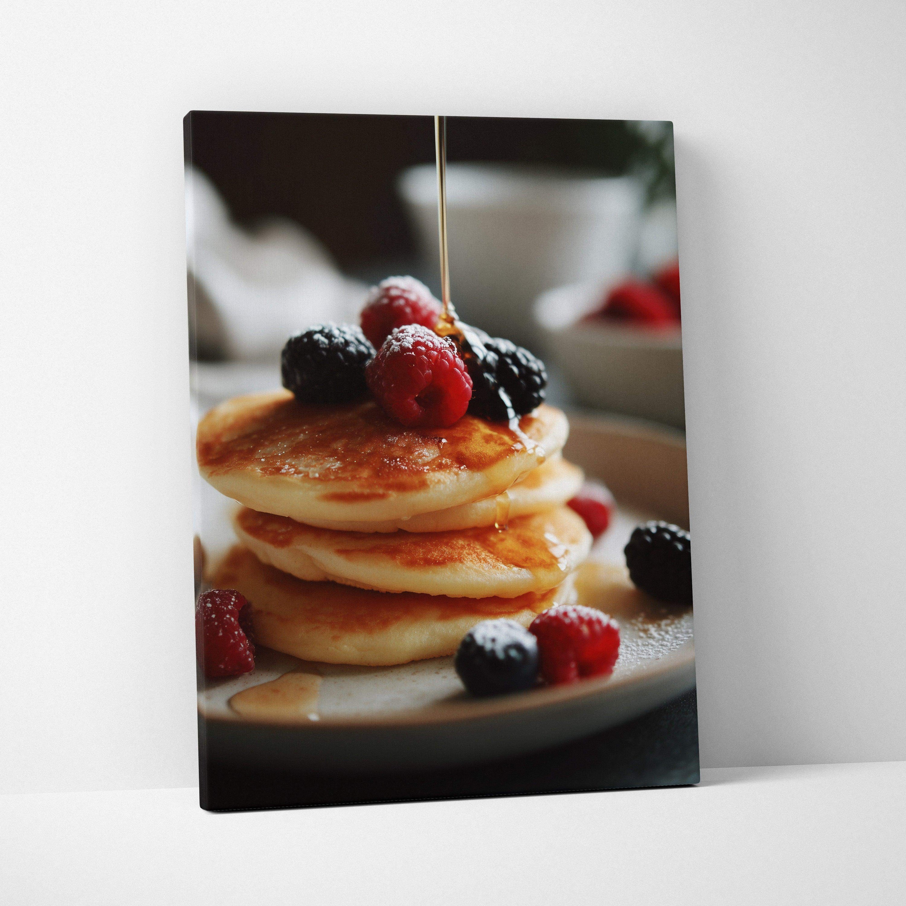 Canvas wall art featuring golden pancakes topped with berries and syrup drizzle, perfect kitchen decor.