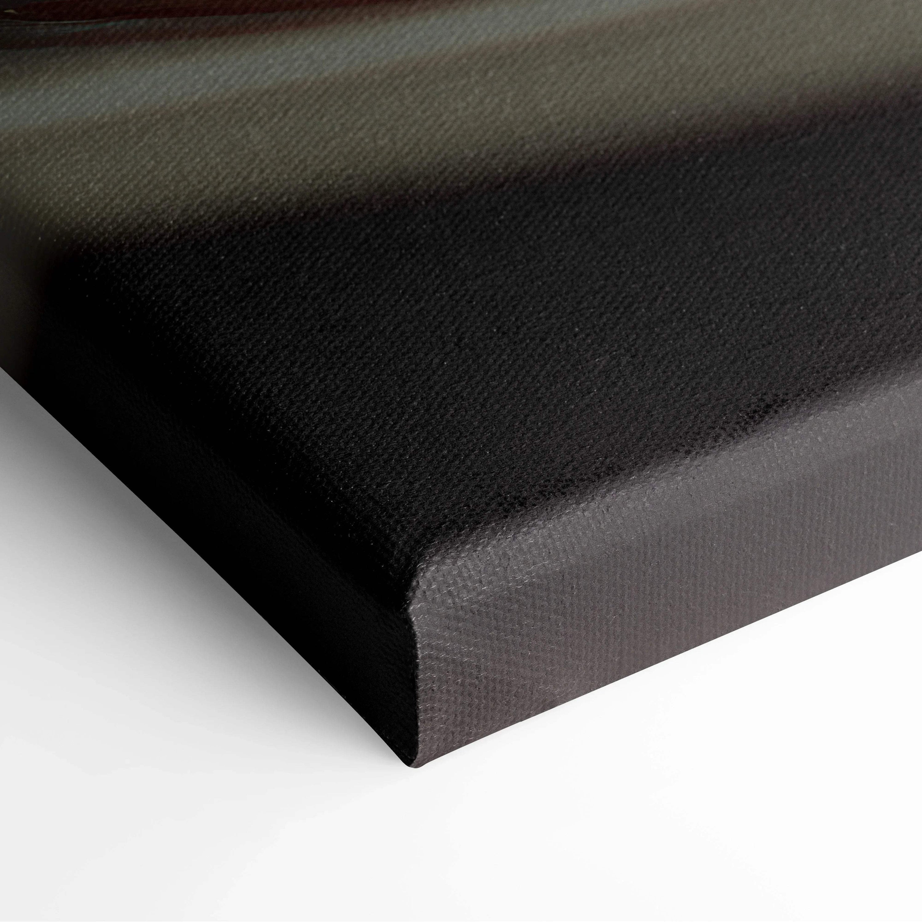 Black gallery-wrapped canvas with a textured surface and sharp folded corners for wall art decor.
