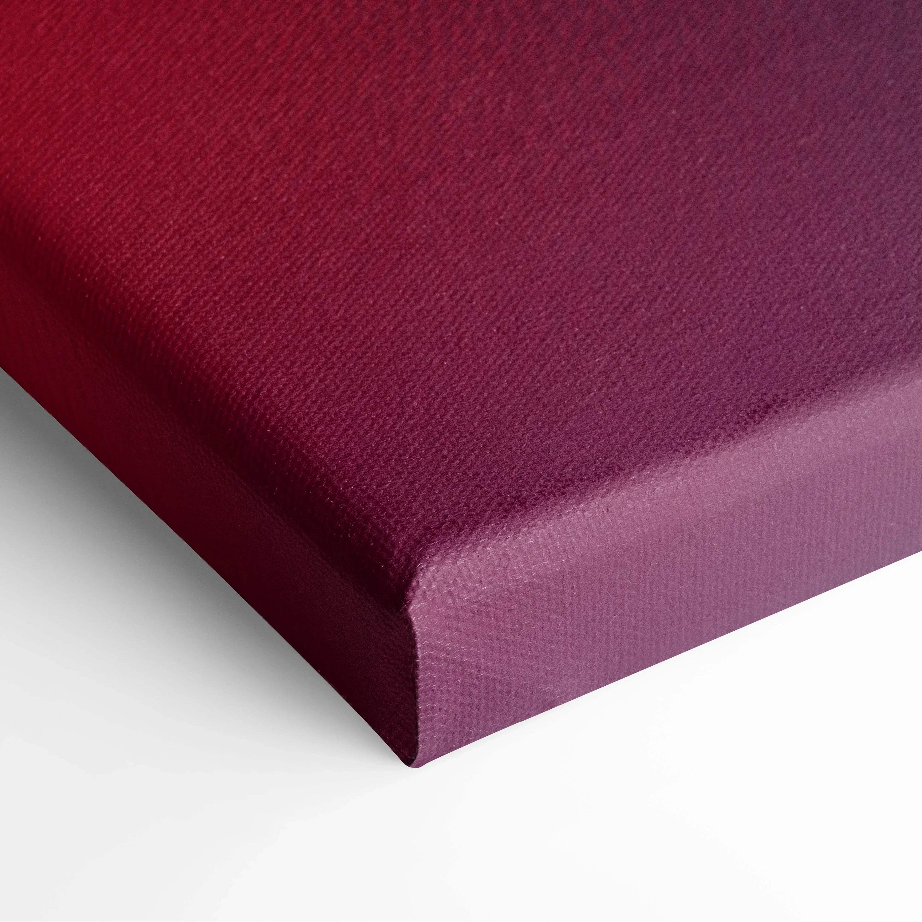 Close-up of deep red textured canvas corner showcasing vibrant abstract wall art material.