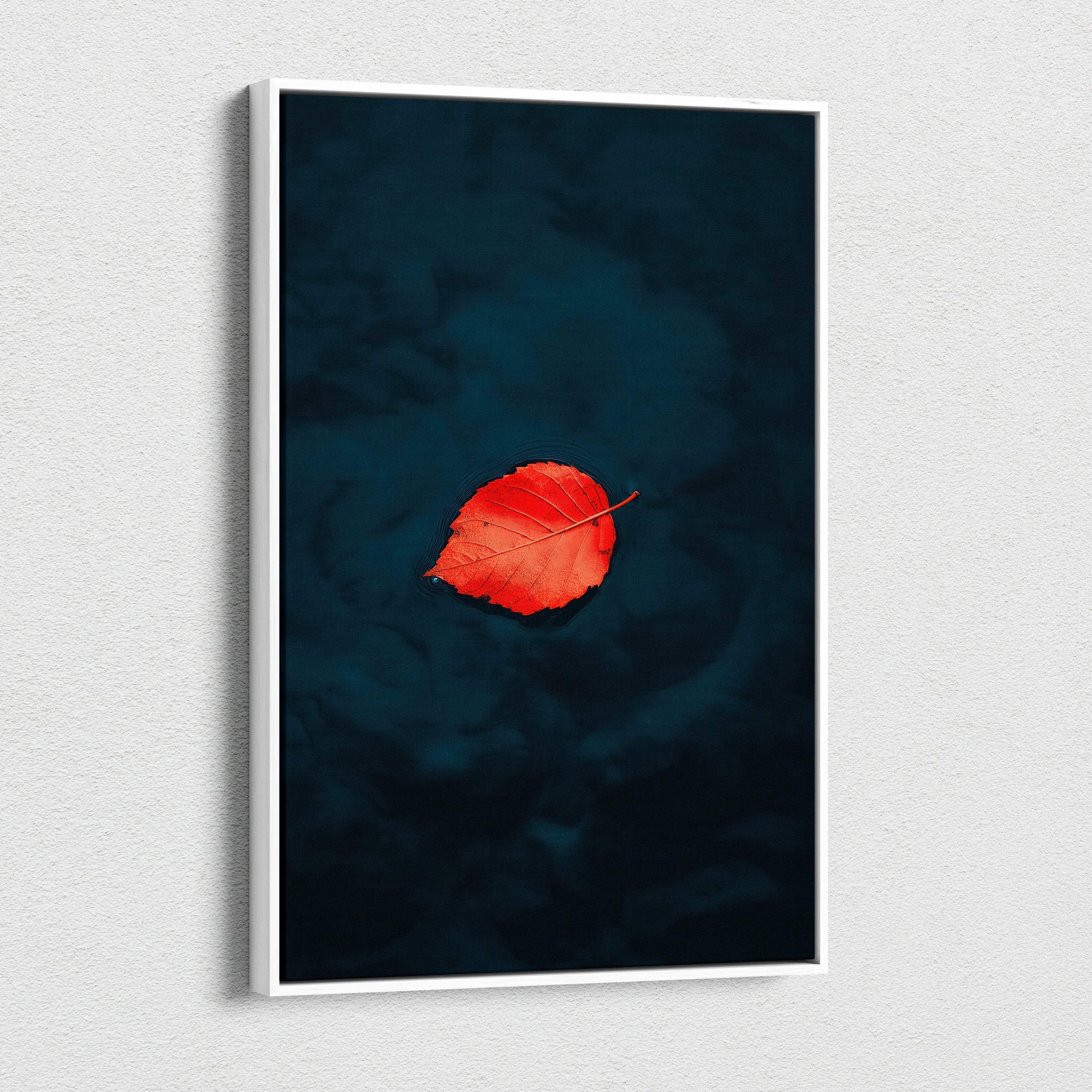 Minimalist autumn canvas wall art featuring a single vibrant red leaf on dark blue background.