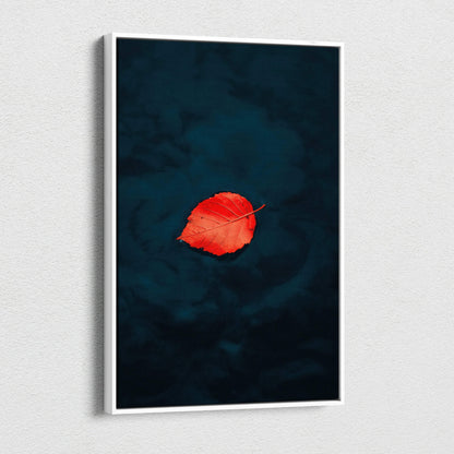 Minimalist autumn canvas wall art featuring a single vibrant red leaf on dark blue background.