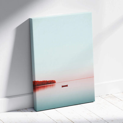 Minimalist canvas wall art with calm blue sky, orange autumn trees, and a lone boat on still water.