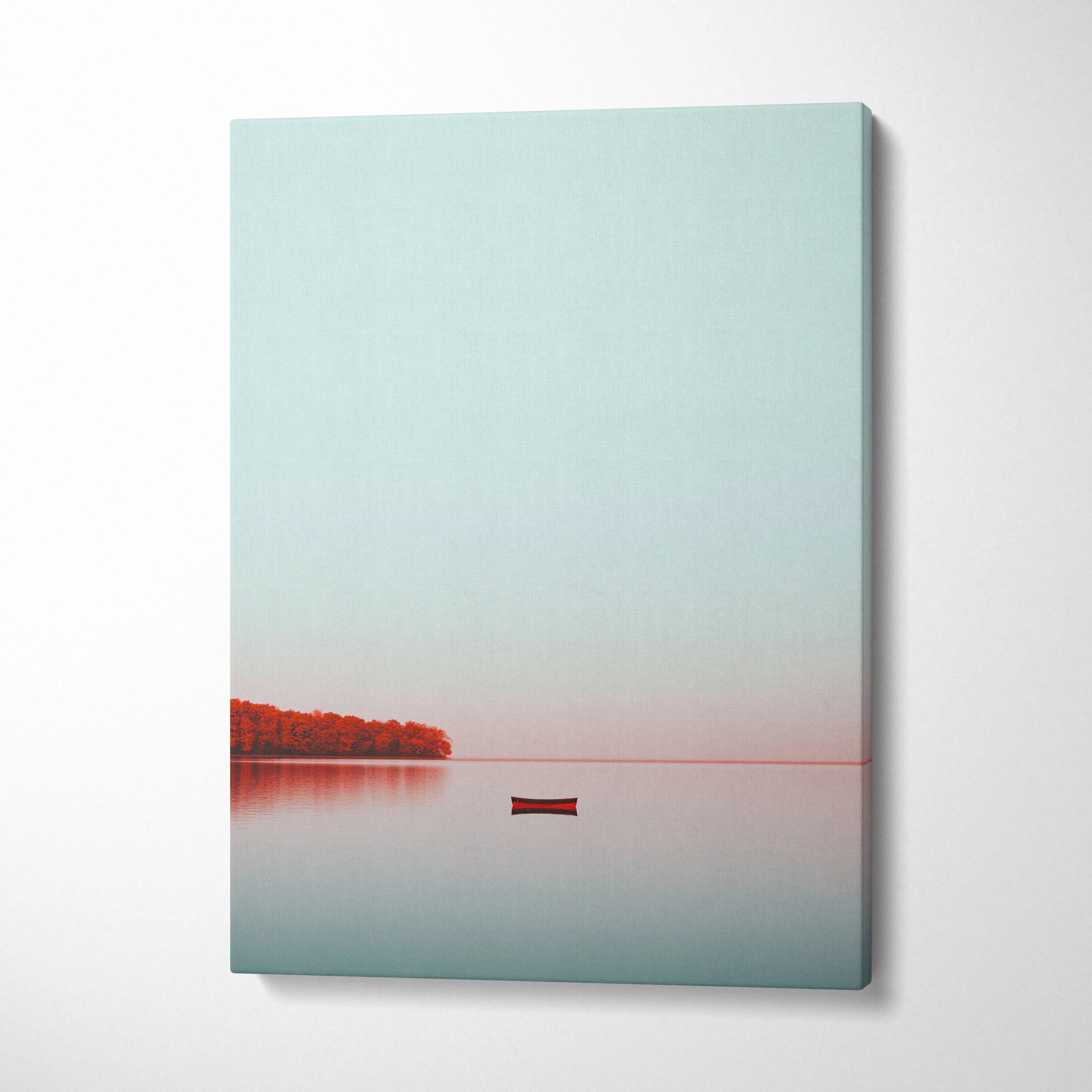 Minimalist autumn nature canvas wall art with calm water, red trees, and lone boat on soft gradient sky.
