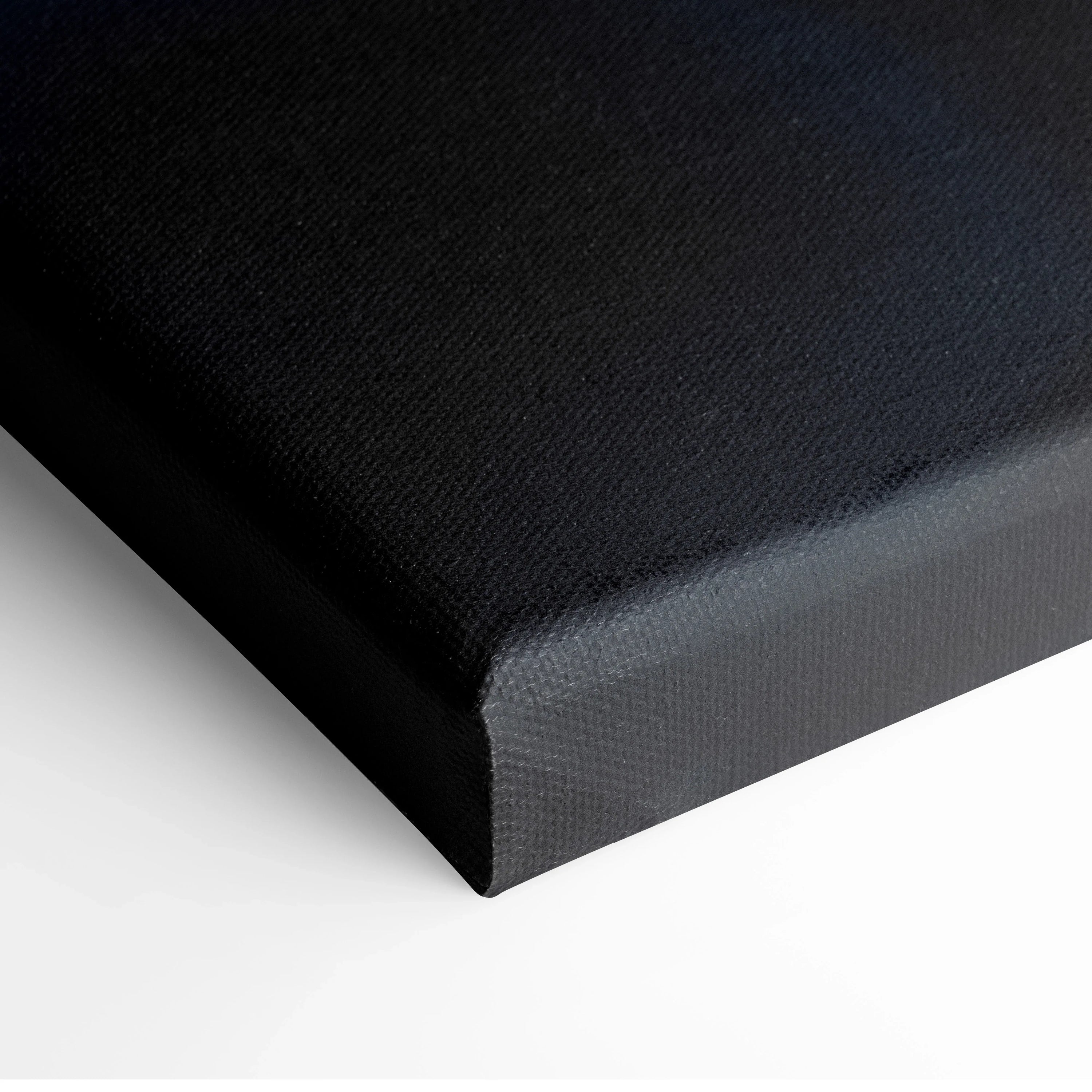 Black stretched canvas wall art with a smooth texture and clean wrapped edges.