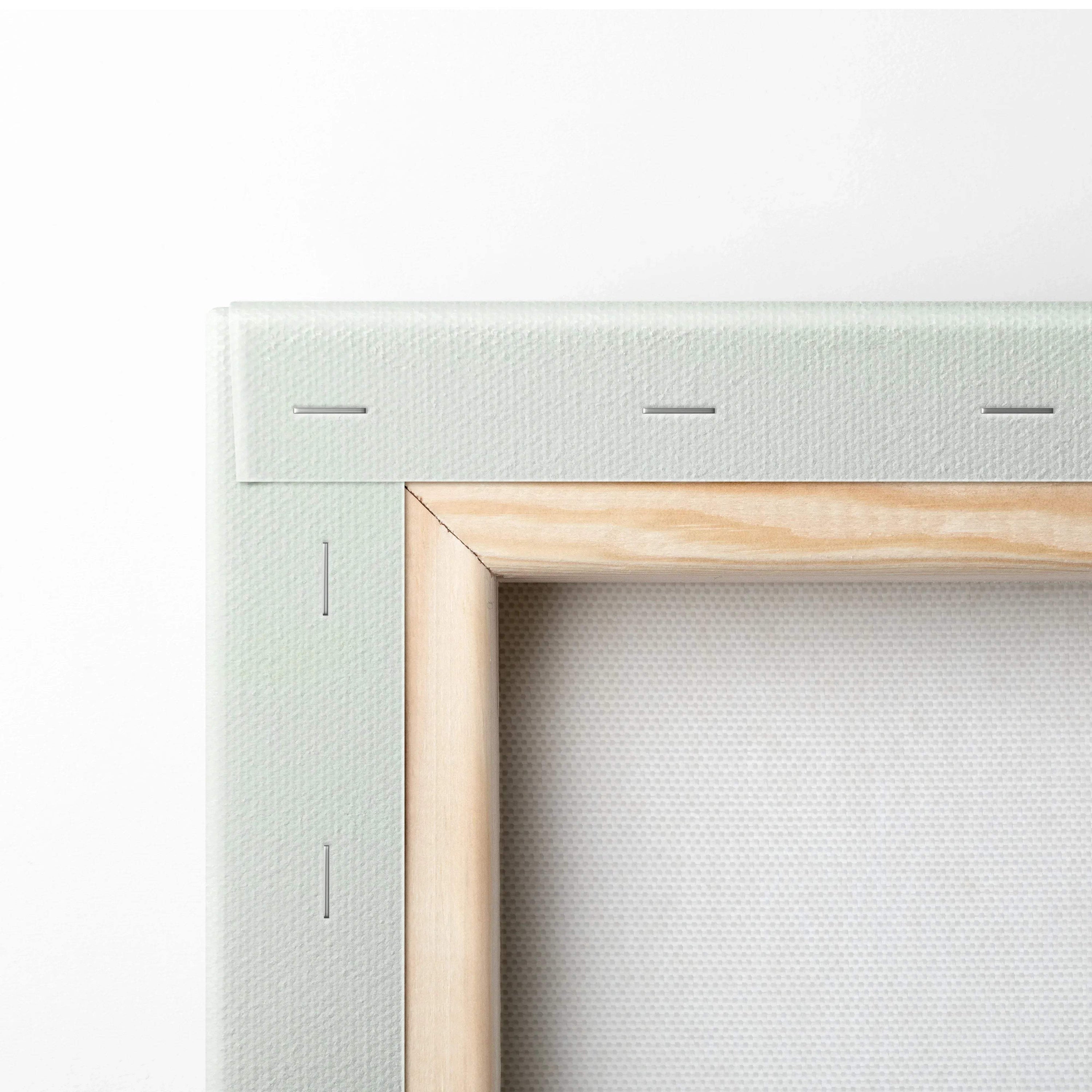 Close-up of wooden frame and white stretched canvas for minimalist canvas wall art.