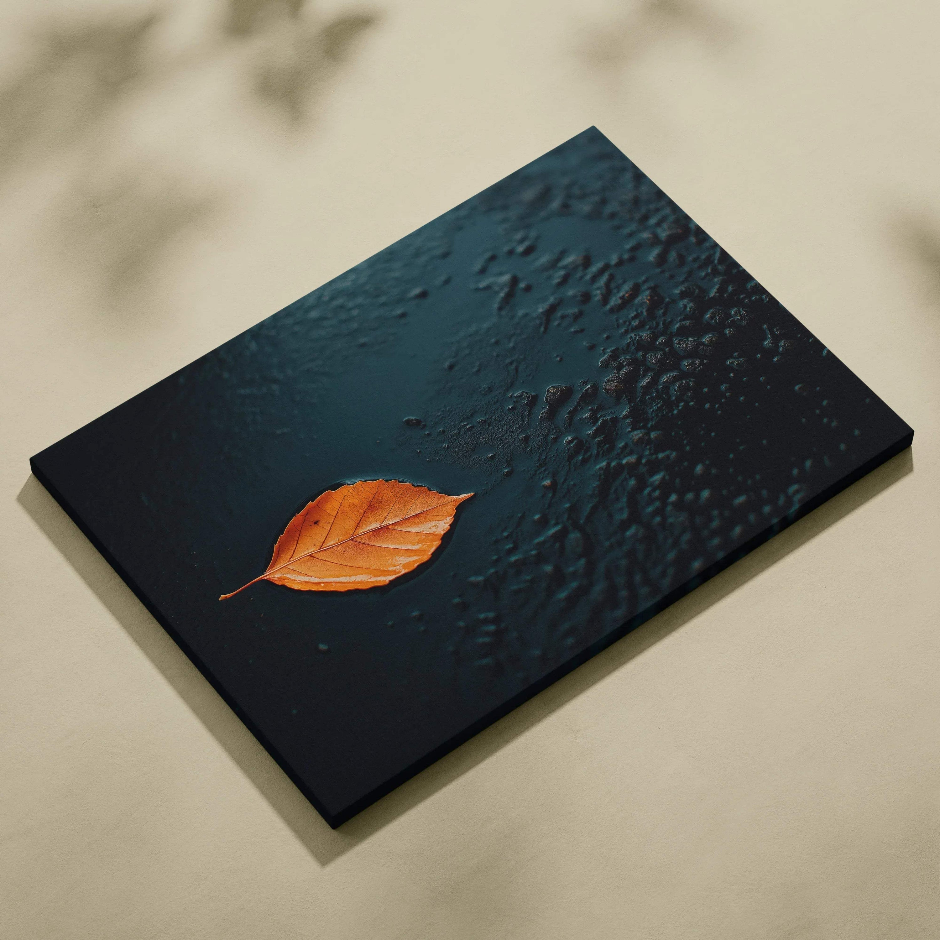 Minimalist autumn leaf on dark textured background canvas wall art with warm earthy tones.