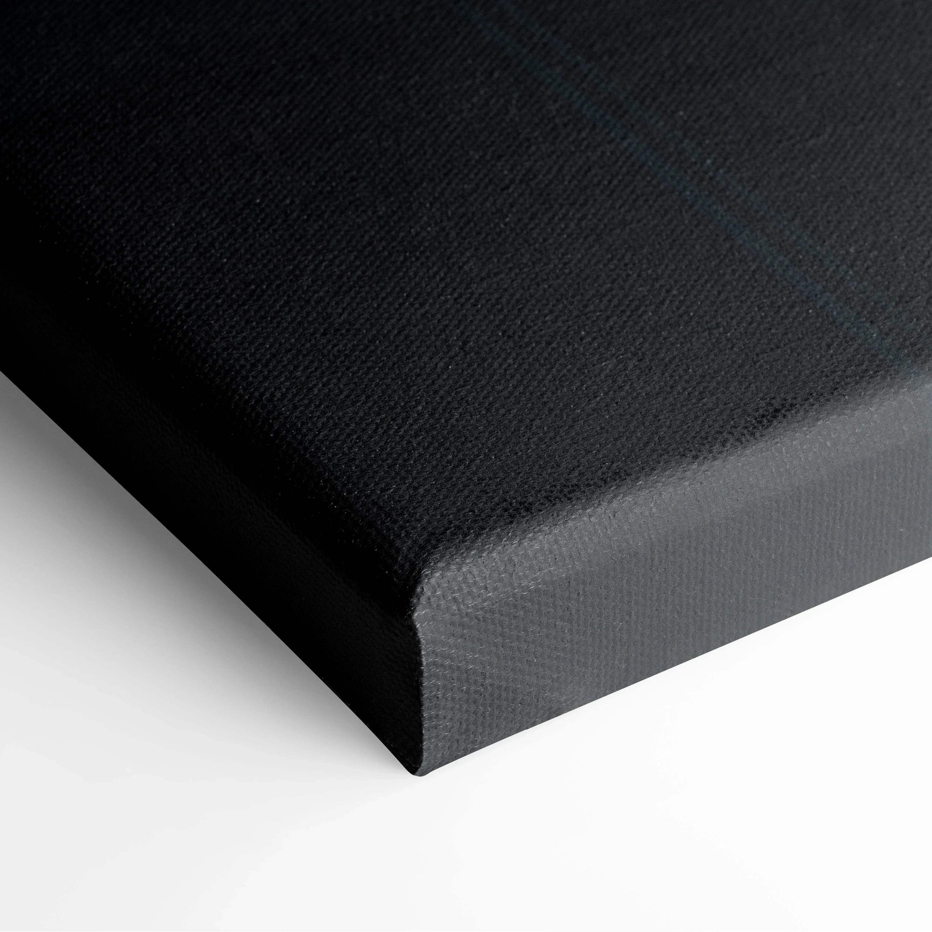 Black stretched canvas corner with visible texture and clean edges for wall art.