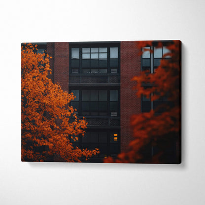 Canvas wall art featuring vibrant autumn leaves against a dark urban building backdrop.