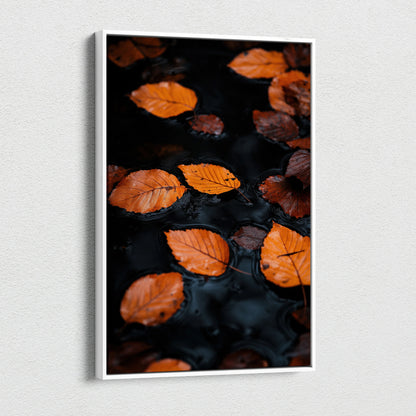 Minimalist autumn leaves floating on dark water canvas wall art with vibrant orange tones.
