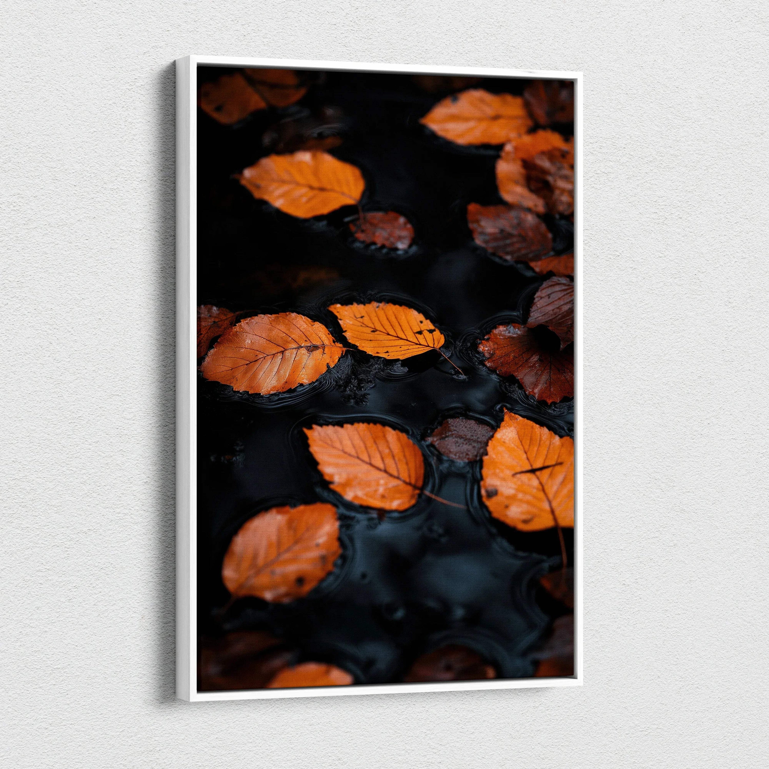 Minimalist autumn leaves floating on dark water canvas wall art print.