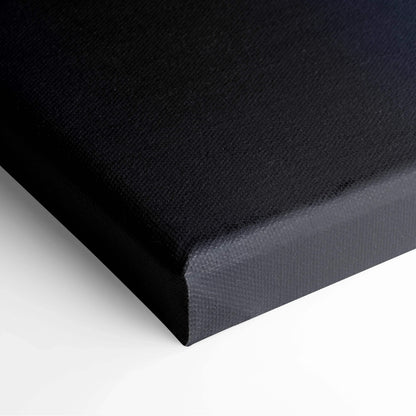 Close-up of black stretched canvas art with textured surface and clean smooth edges for wall art display.