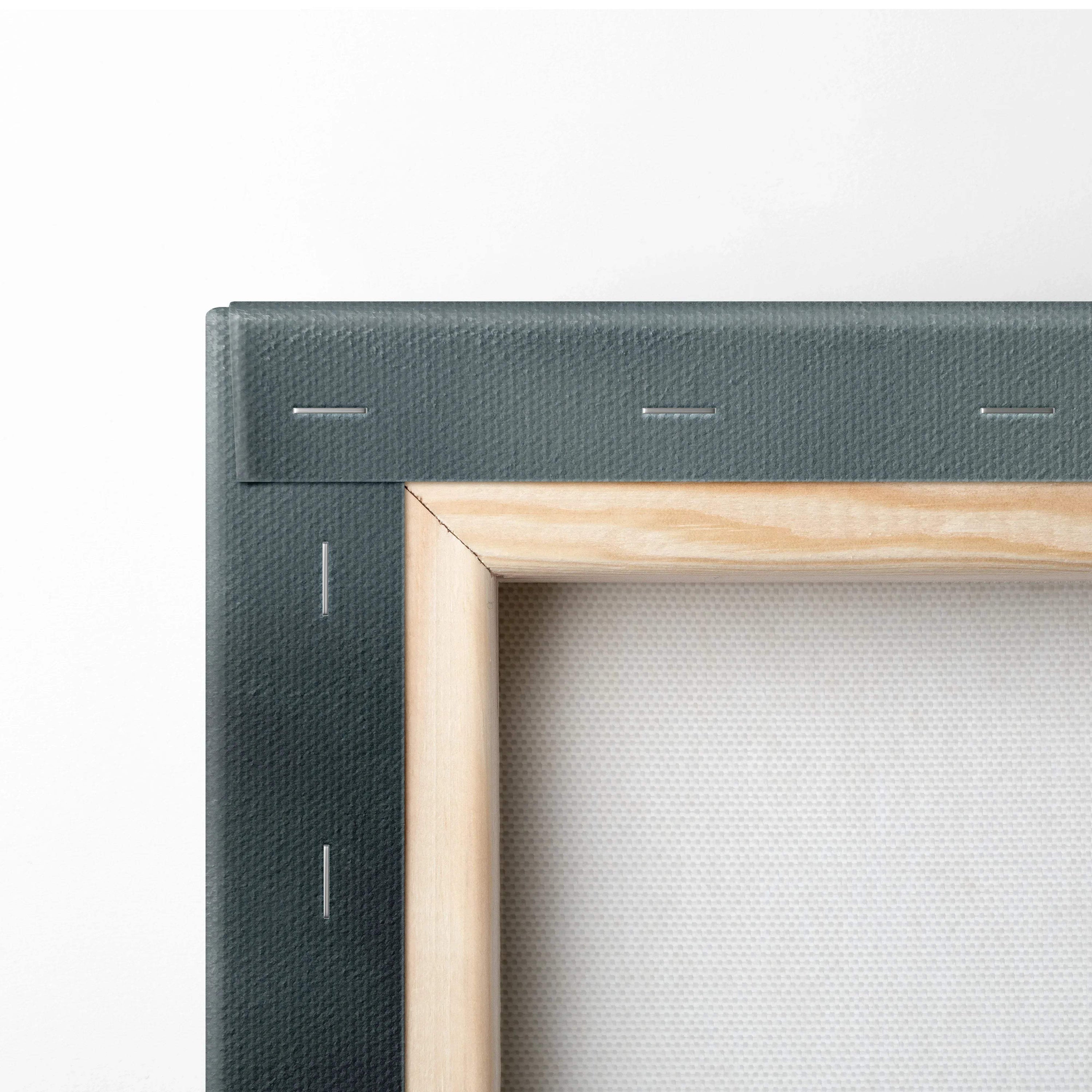 Close-up of wooden frame and stretched white canvas with dark textured canvas art backing on wall art canvas.