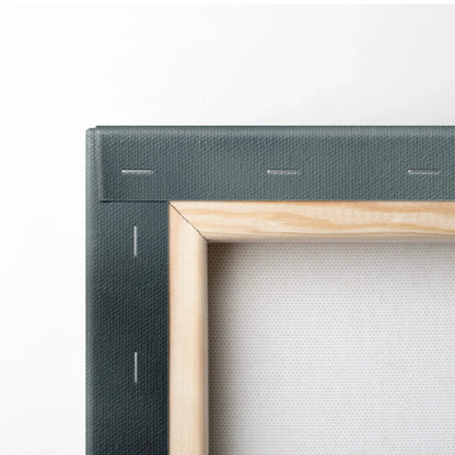 Close-up of wooden frame and stretched white canvas with dark textured canvas art backing on wall art canvas.
