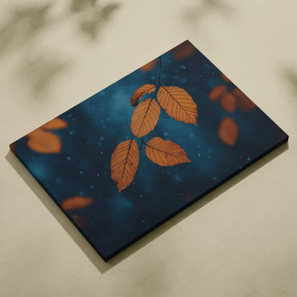 Canvas wall art featuring minimalist autumn leaves in vibrant orange against a deep blue background.