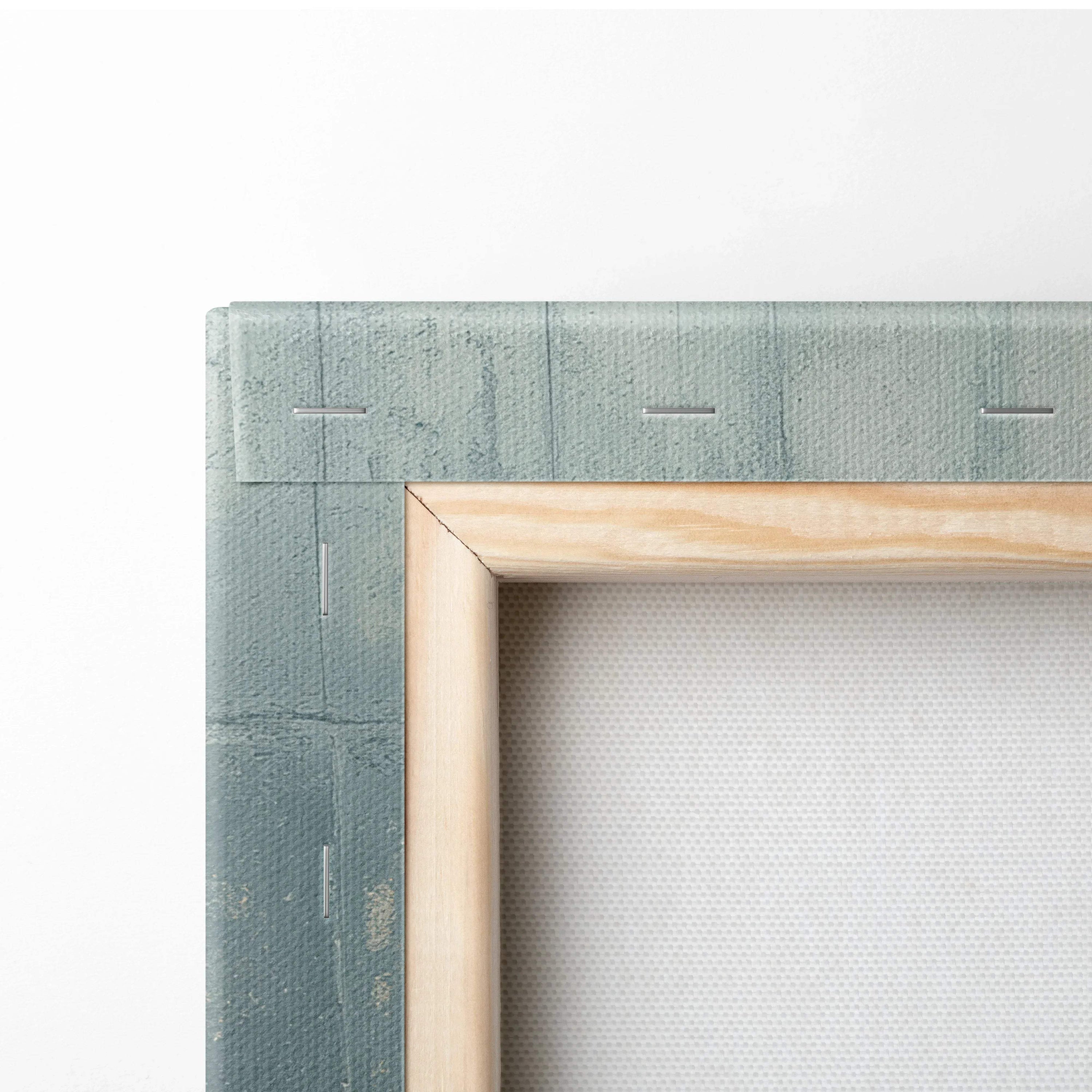 Close-up of stretched canvas art with wooden frame, textured fabric and painted green edge for wall art.