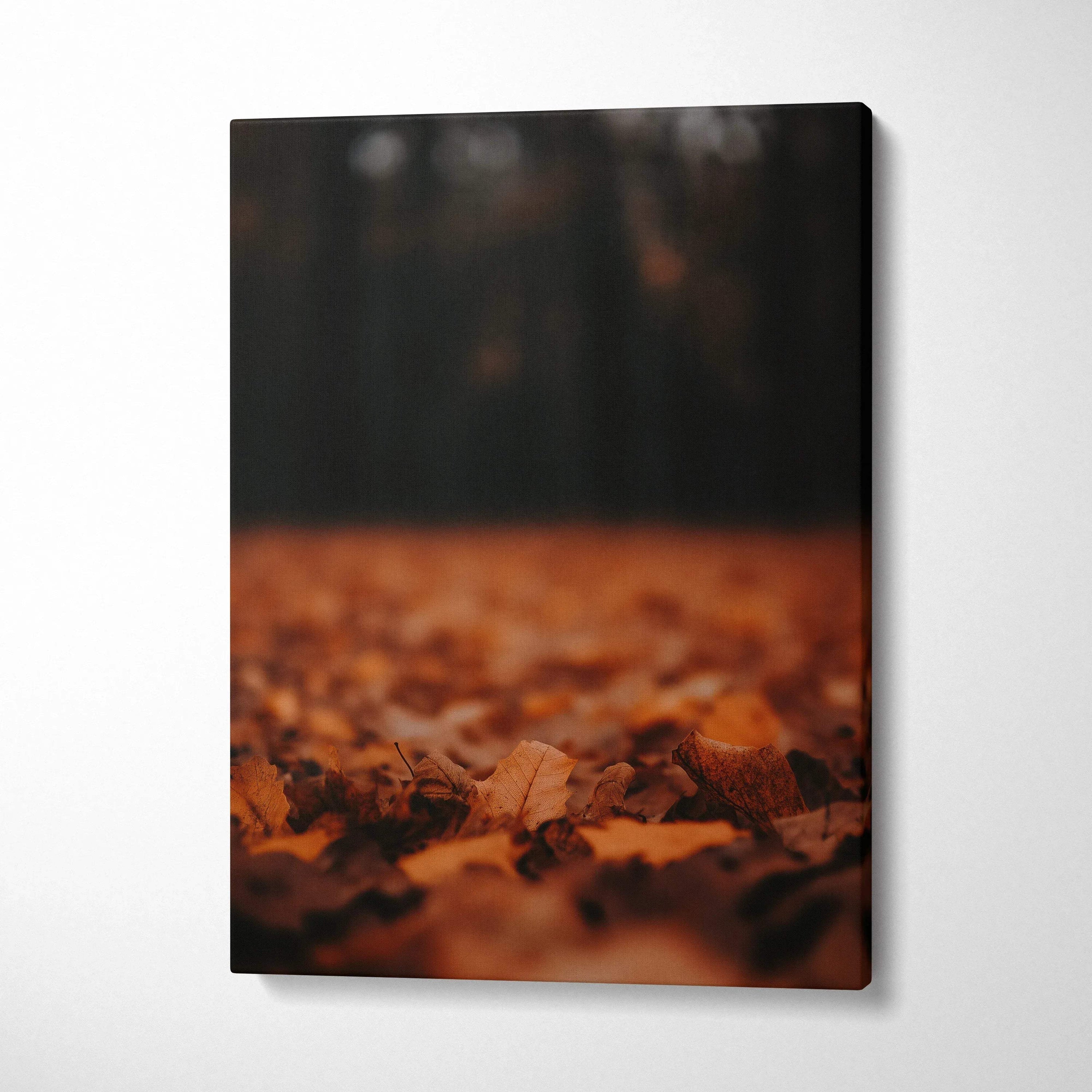 Autumn-themed minimalist canvas wall art featuring close-up of fallen leaves in warm brown tones.