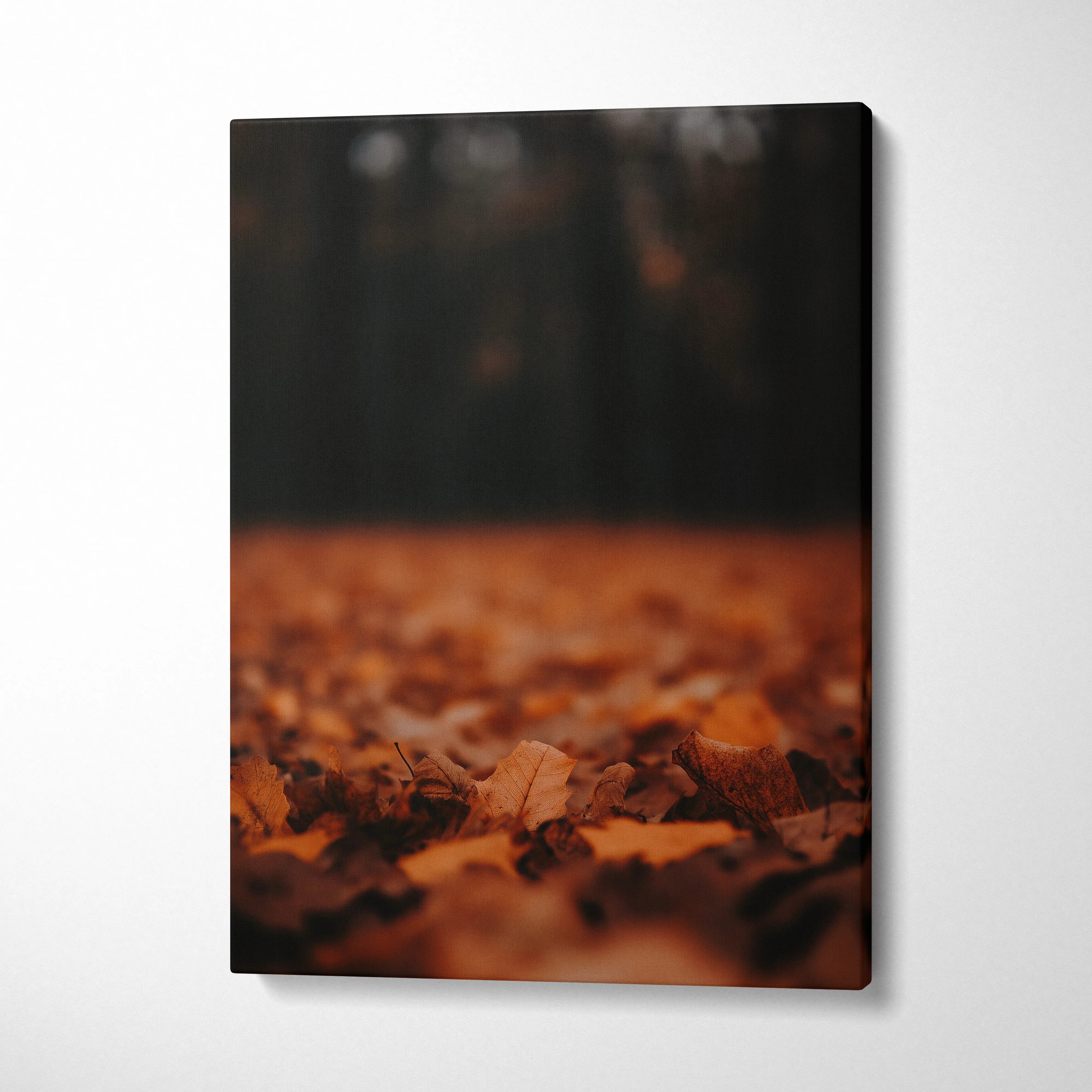Autumn-themed minimalist canvas wall art featuring close-up of fallen leaves in warm brown tones.