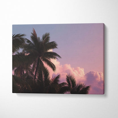 Canvas wall art featuring tropical palm trees silhouette against a pink and purple sunset sky for decor.