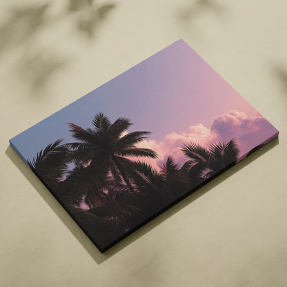Canvas wall art featuring black tropical palm trees silhouetted against a pink and purple sunset sky.