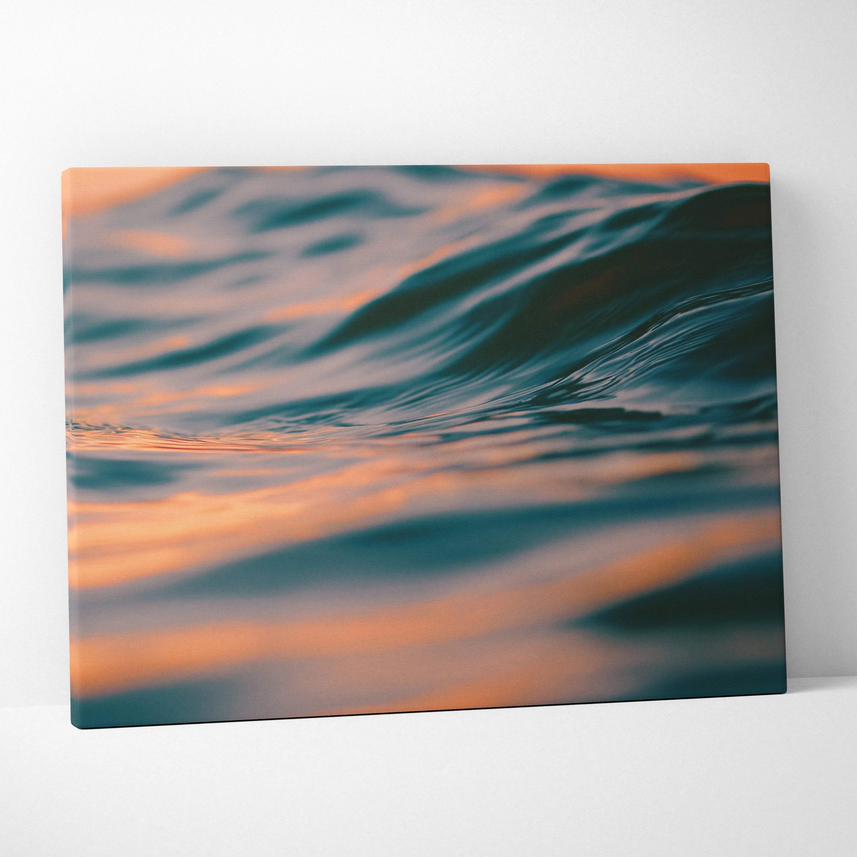 Canvas wall art featuring digital tropical ocean waves at golden hour sunset with warm orange and blue tones for decor.