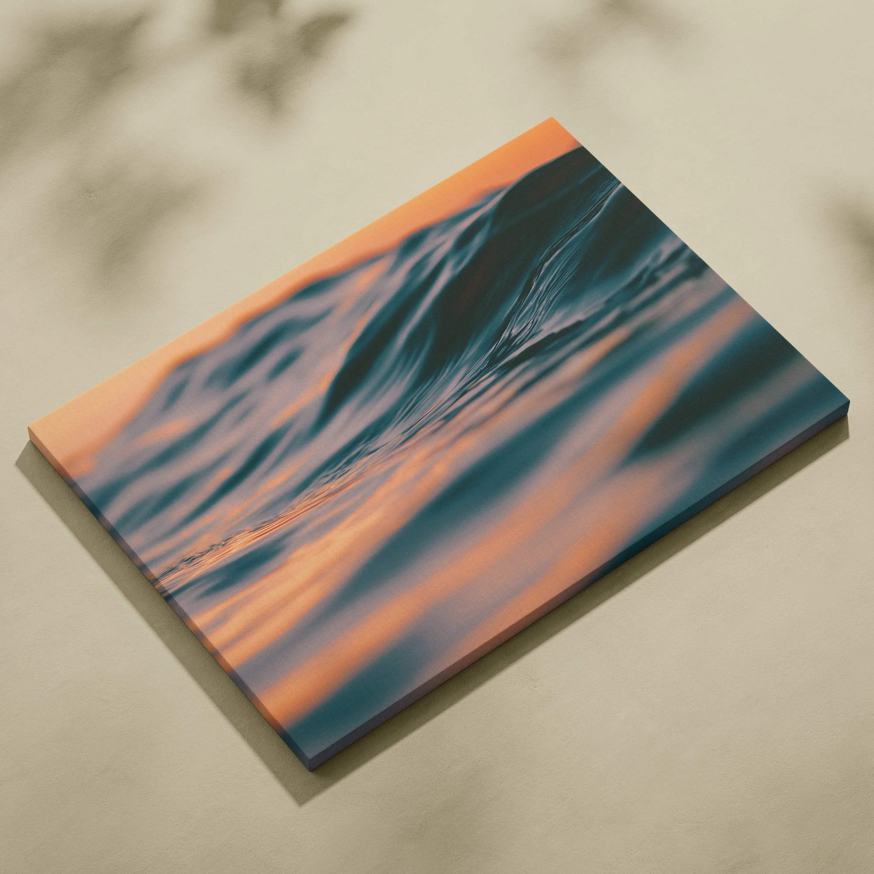 Canvas wall art featuring digital tropical ocean waves at golden hour sunset with warm orange and deep blue tones.