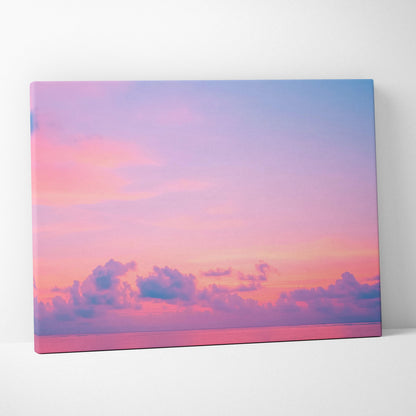 Canvas wall art featuring a tropical sunset with pink and purple clouds over a calm ocean horizon.