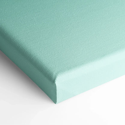 Close-up of turquoise canvas wall art with textured fabric and wrapped edges.
