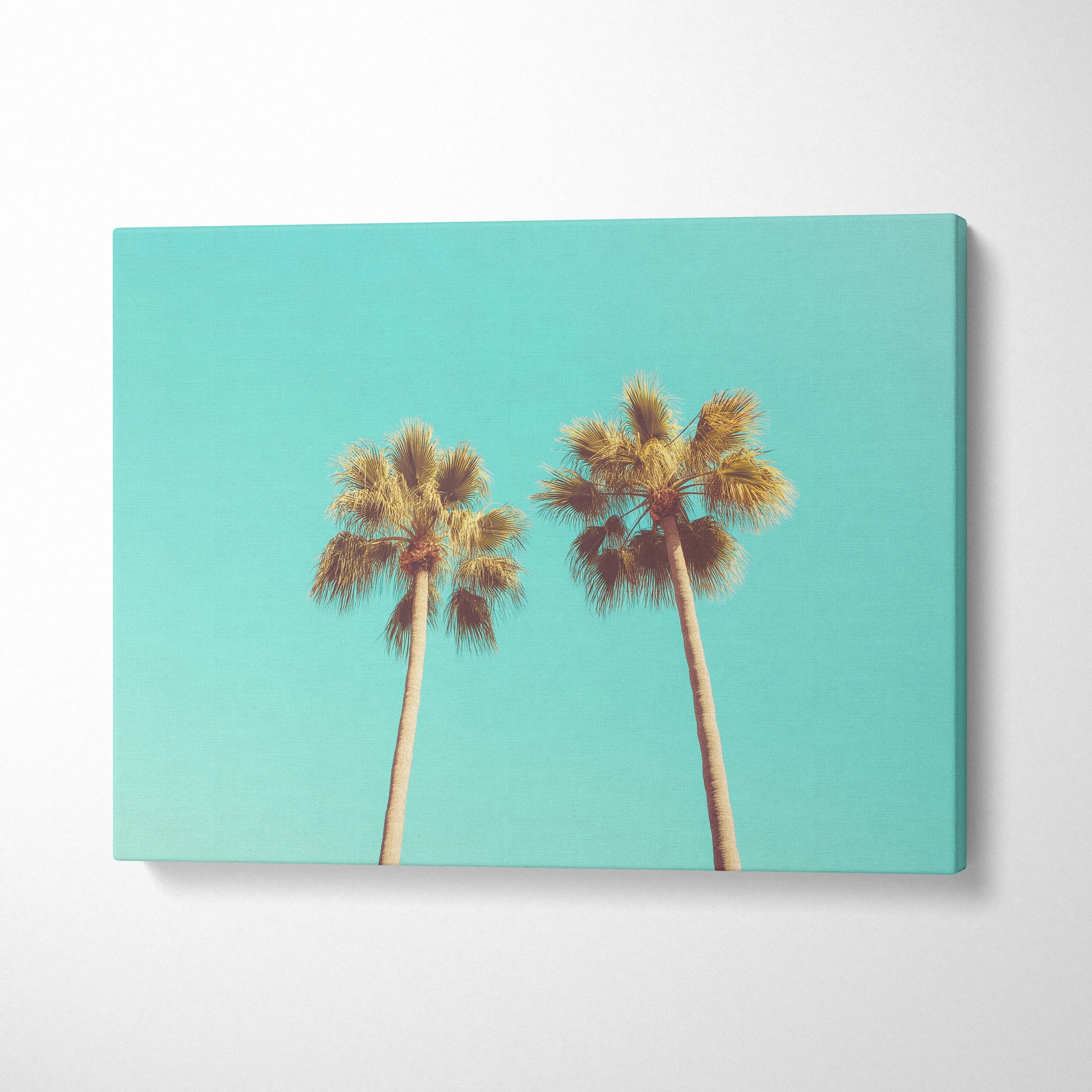 Tropical palm trees canvas wall art with turquoise sky background, modern decor piece.