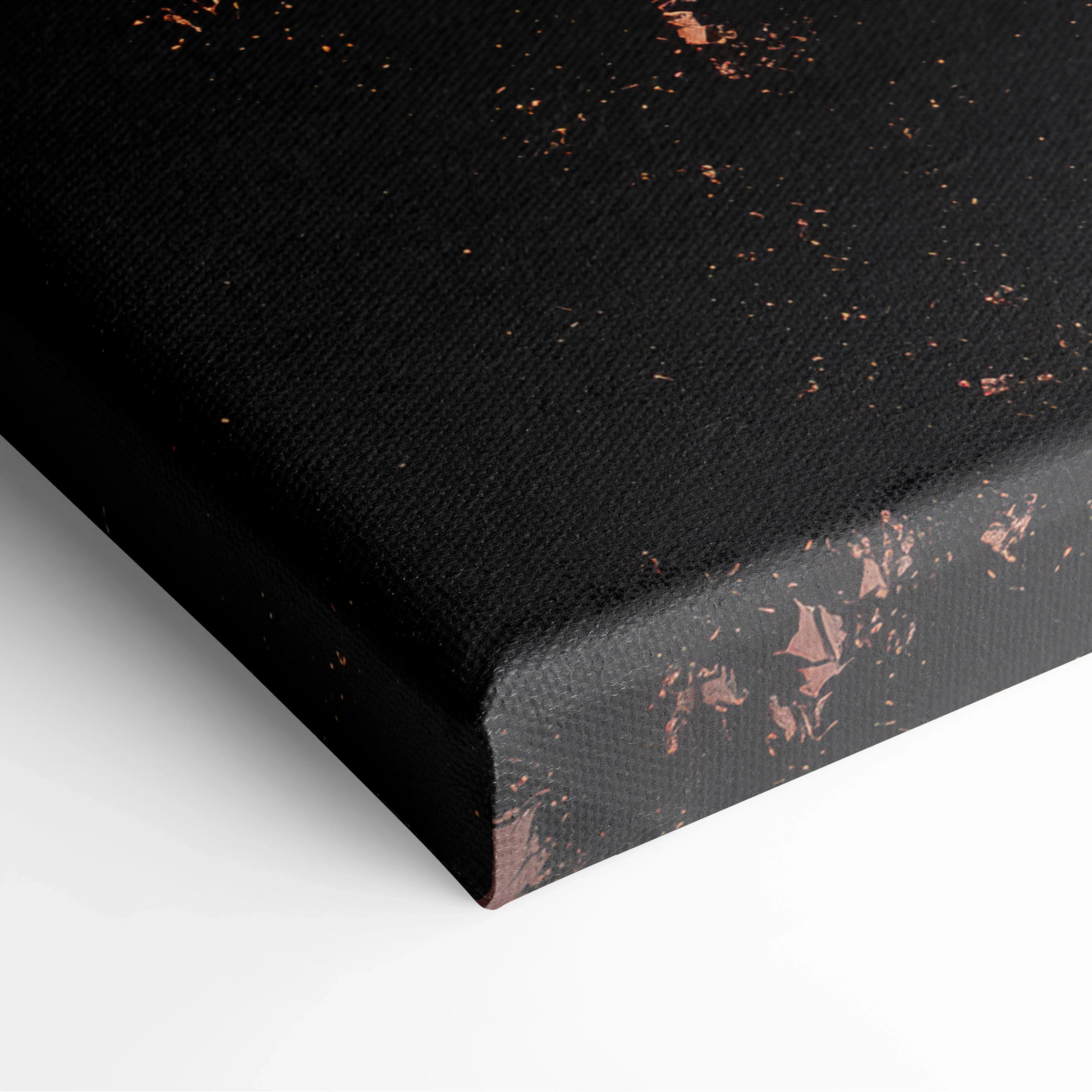 Black canvas wall art with subtle copper splatter detailing on textured fabric edges.