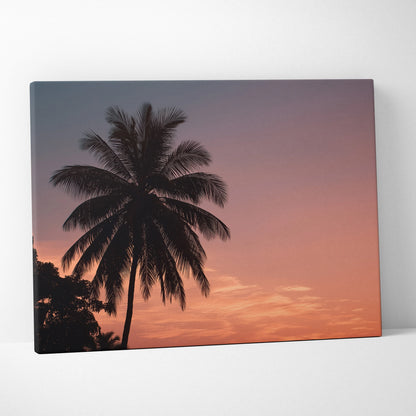 Canvas wall art featuring a dark palm tree silhouette against a vibrant orange and purple tropical sunset sky.