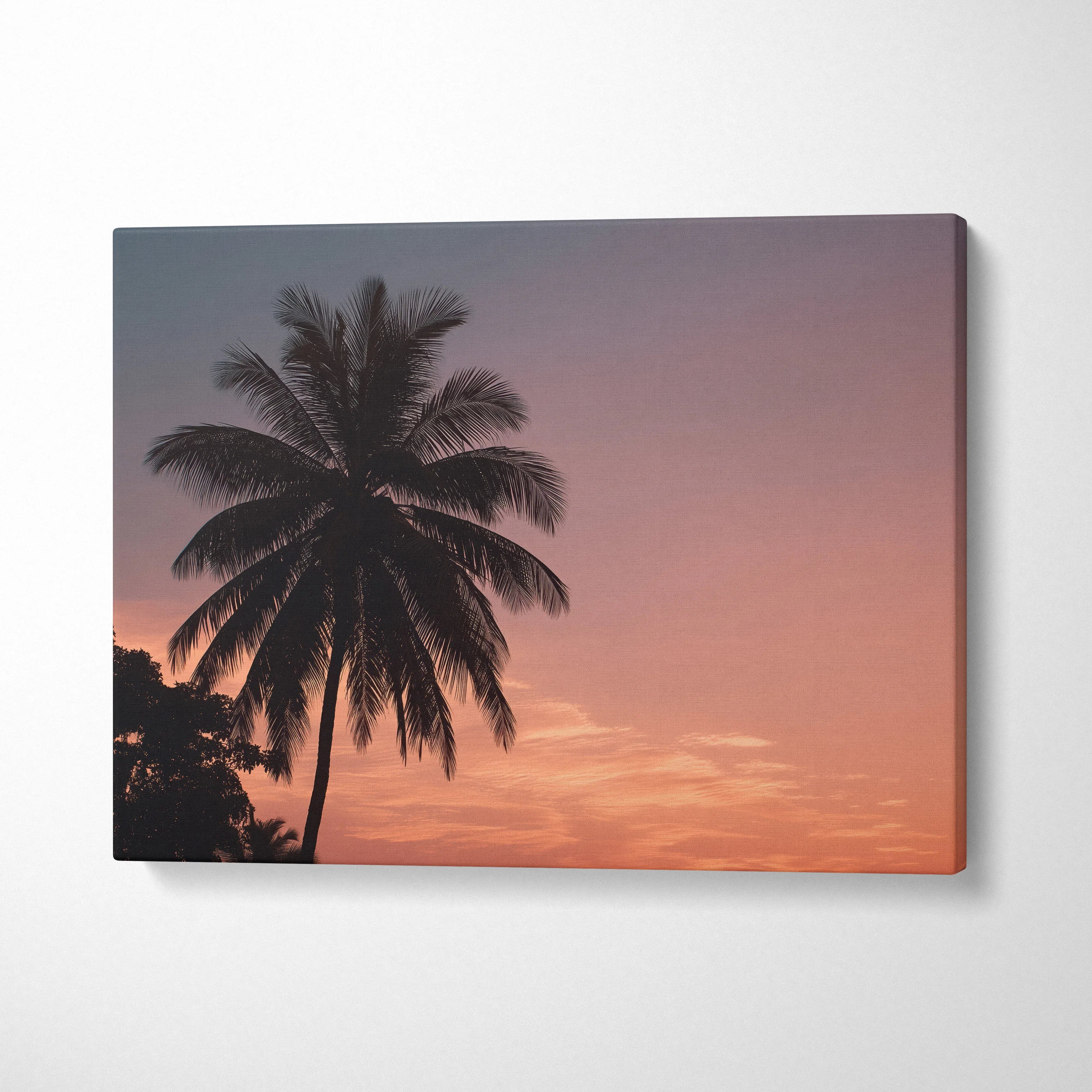 Canvas wall art featuring a digital tropical sunset with silhouette palm trees and vibrant coastal sky colors.