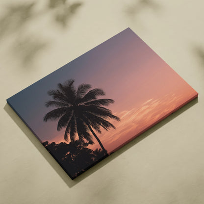 Canvas wall art featuring a tropical palm tree silhouette at sunset with warm coastal colors.