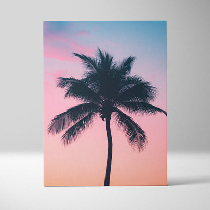 Canvas wall art featuring a tropical palm tree silhouette against a pink and blue sunset sky decor.