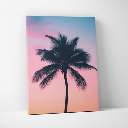 Canvas wall art featuring a black palm tree silhouette against a gradient sunset sky in pink and blue tones.