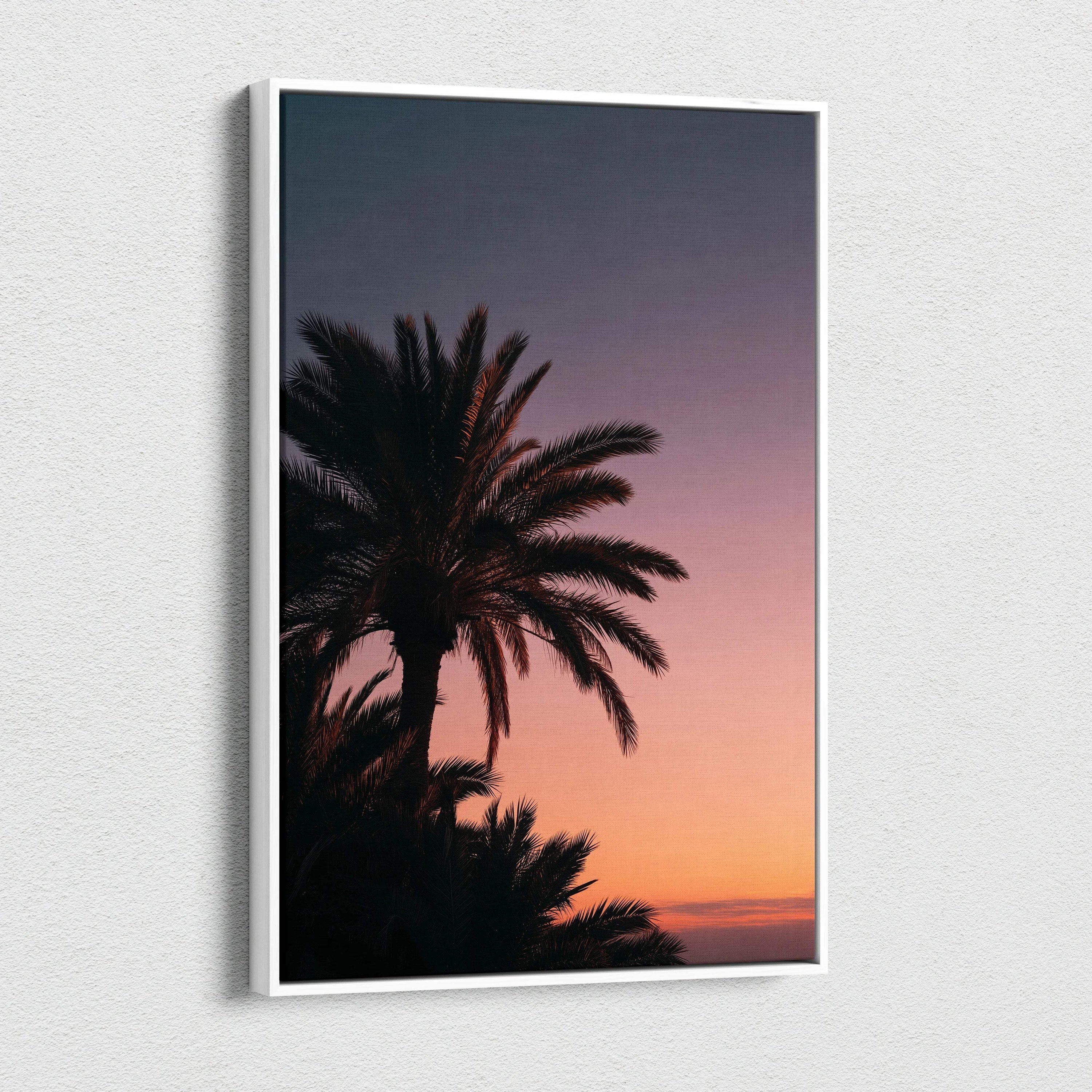 Canvas wall art featuring a tropical palm tree silhouette against a vibrant sunset sky decor.
