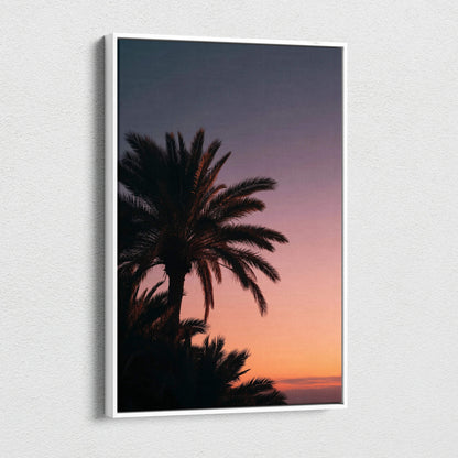 Canvas wall art featuring a tropical palm tree silhouette against a vibrant sunset sky decor.